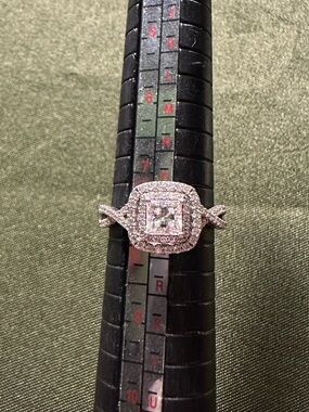 Sterling silver engagement style ring. Unsure of stones. Size 8